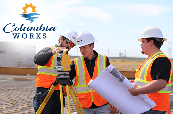 Columbia Works Summer Intern with engineers using a leveling tool