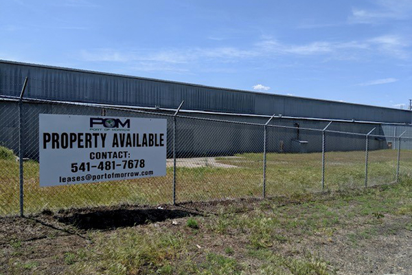 The mill property in Heppner with a sign reading Property Available, contact 541-481-7678