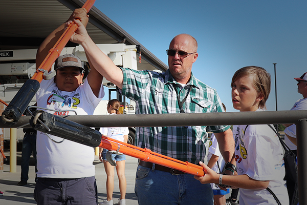 Students using lineman tools at the Nuts, Bolts, and Thingamajigs Camp